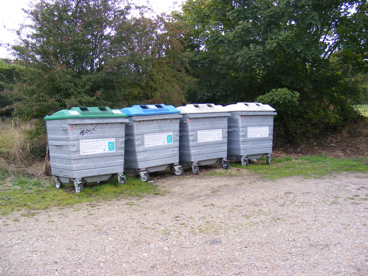 Glass banks at Peasenhall, in East Suffolk. Since 1 June 2026 glass bottles and jars also go in the blue-lidded bin at the kerb, so the banks are no longer the only option