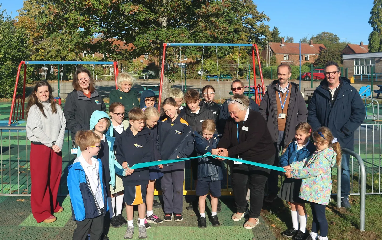 Children and council staff cut the ribbon on the rebuilt Newnham Avenue play area in Woodbridge
